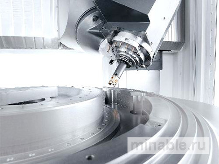 Высокоточный обрабатывающий центр с фронтальным погрузчиком от компаний DMG/Mori Seiki